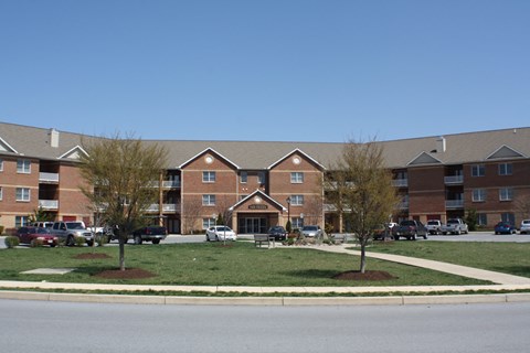 an apartment building on the side of a street