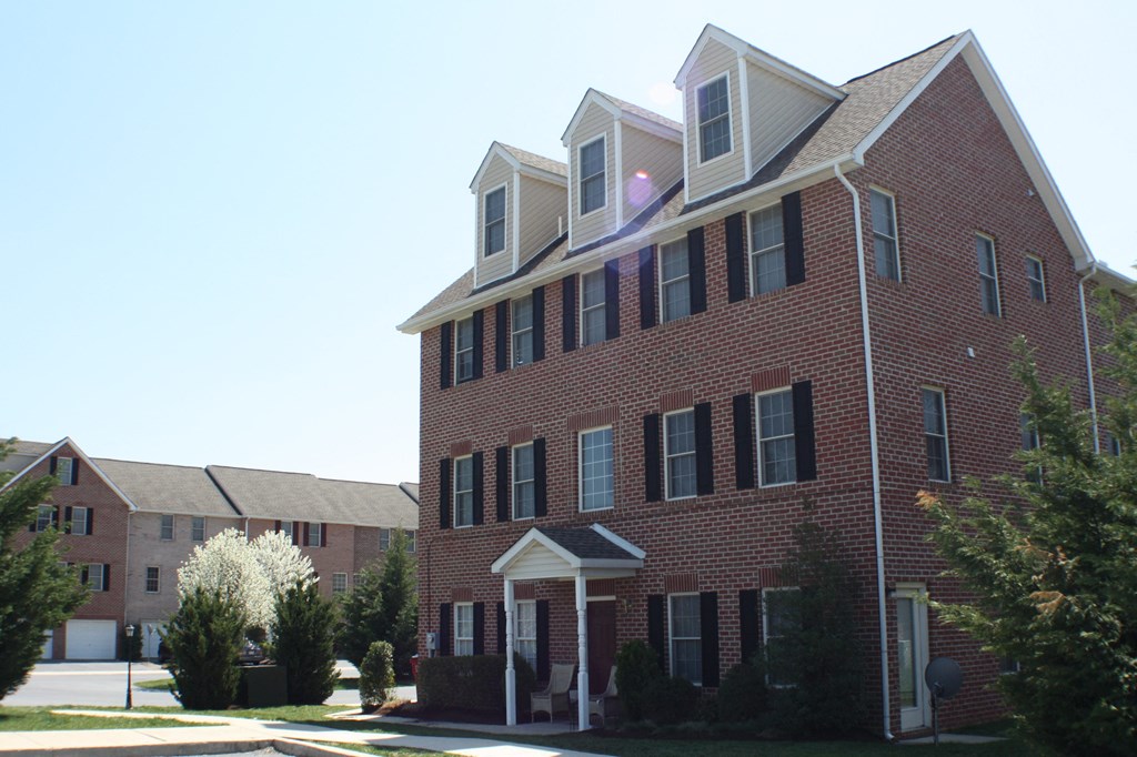 3 story brick building with front stoop  at Rosewood Village, Hagerstown, Maryland