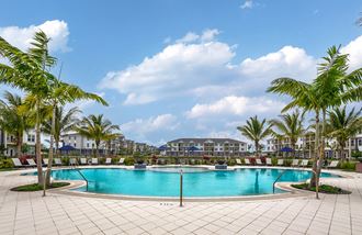 a resort style swimming pool at the enclave at woodbridge apartments in sugar land, tx