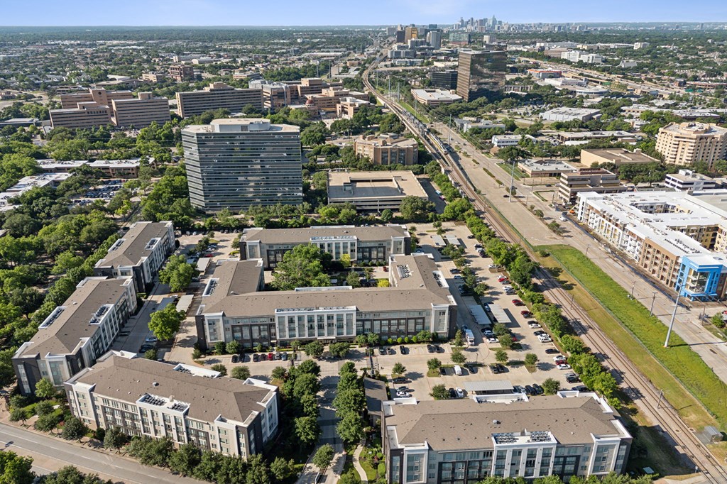 an aerial view of a city with buildings and roads