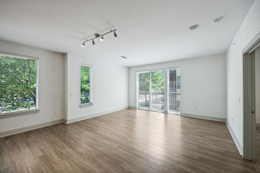a large white room with projections on the walls and wooden floors