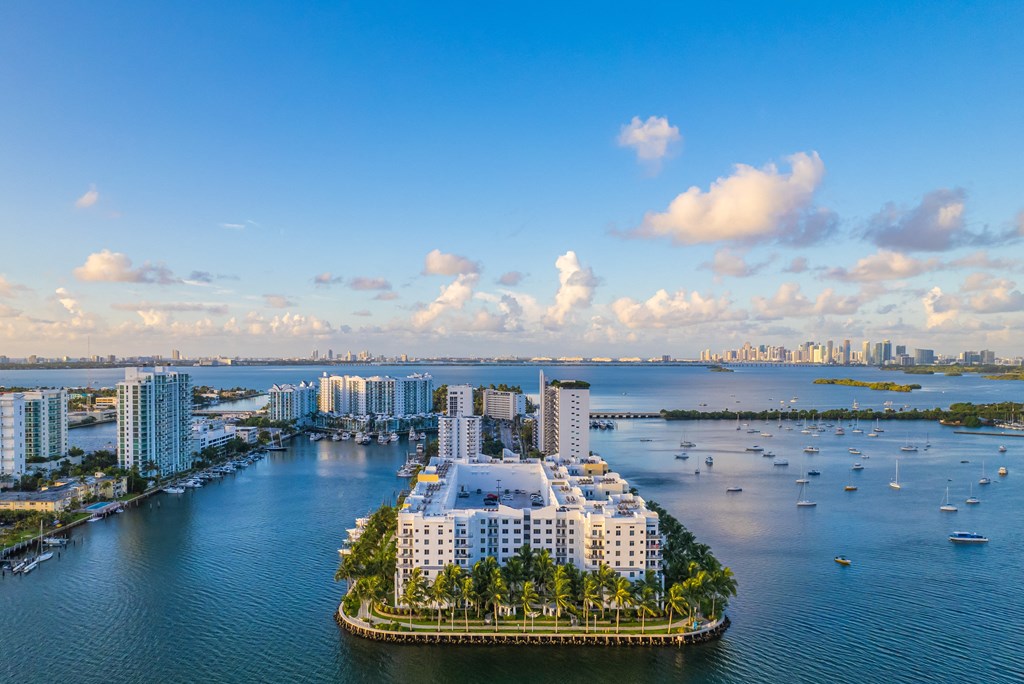 an aerial view of a body of water with buildings and boats