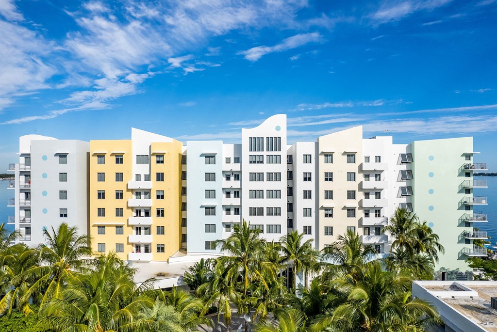 a rendering of the residence inn clearwater beach with palm trees