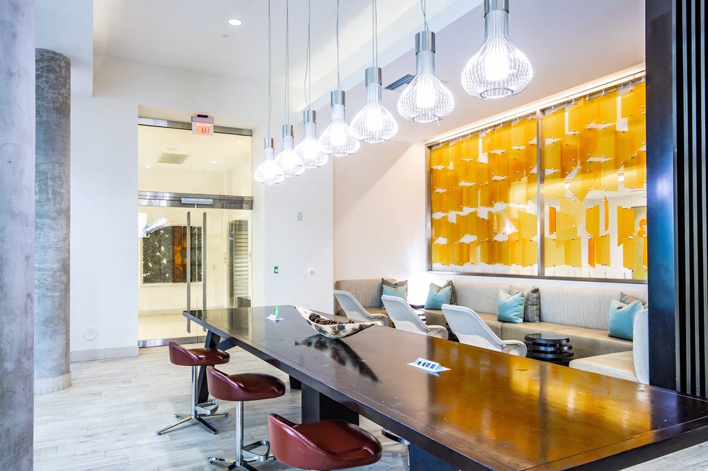 a conference room with a long wooden table and chairs