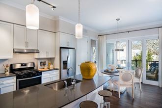 a kitchen and dining area in a 555 waverly unit