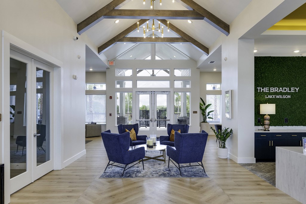 the bradley living room with blue chairs and a table