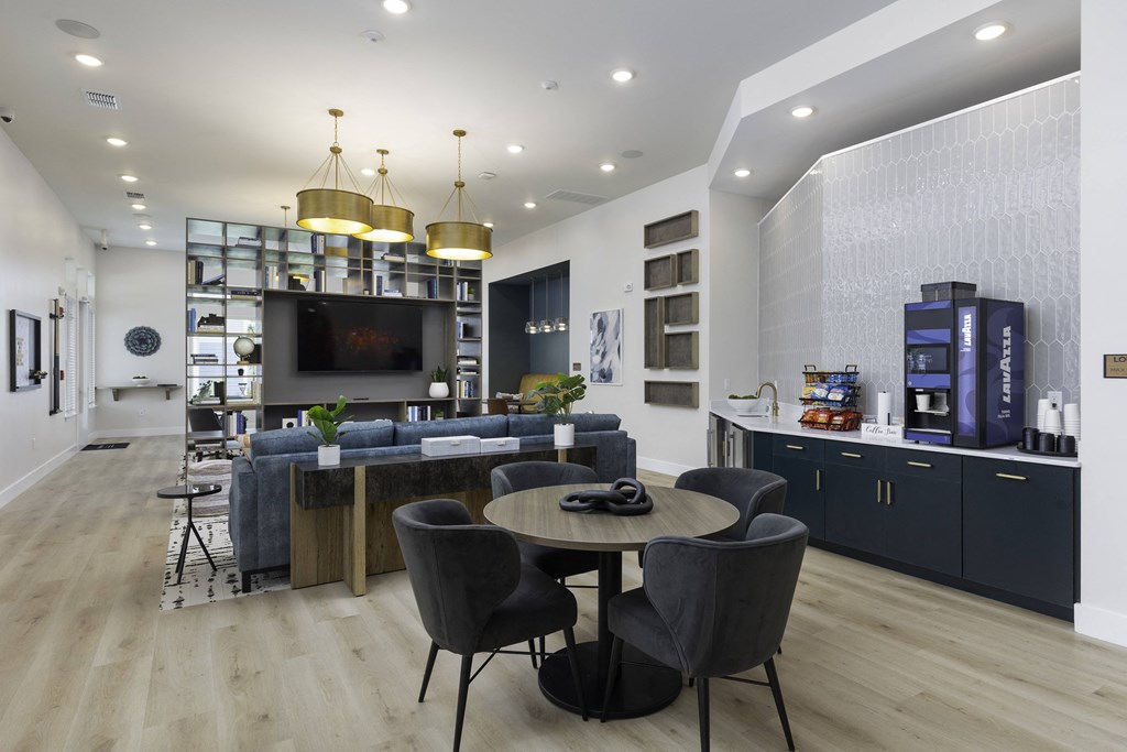 a living room with a table and chairs and a television