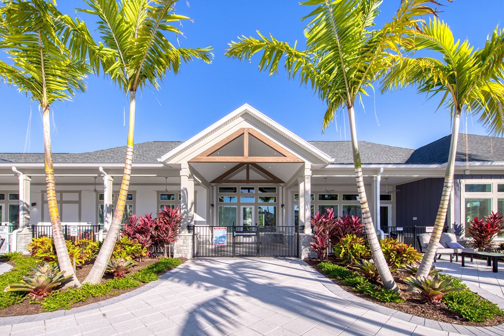 a house with palm trees in front of it