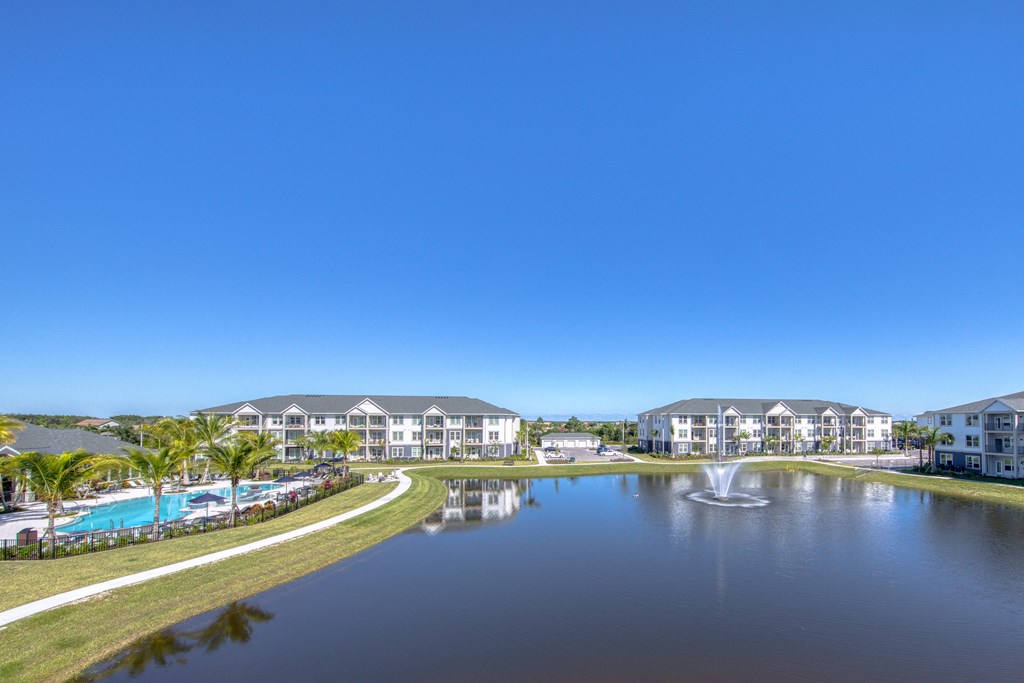a pond with a fountain in the middle of a building