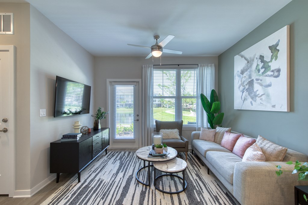 a living room with a couch and a tv
