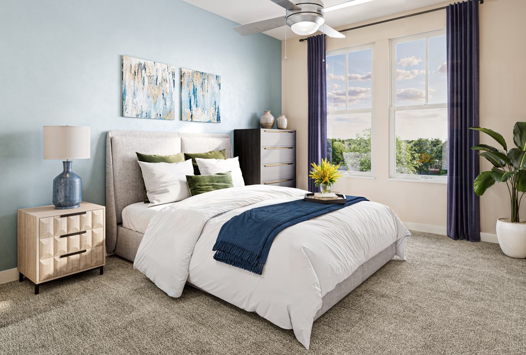 a bedroom with blue and white walls and a bed