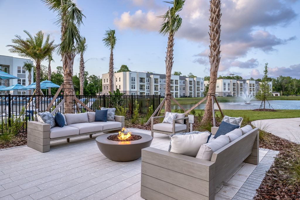 Firepit surrounded by resident and guest seating area.