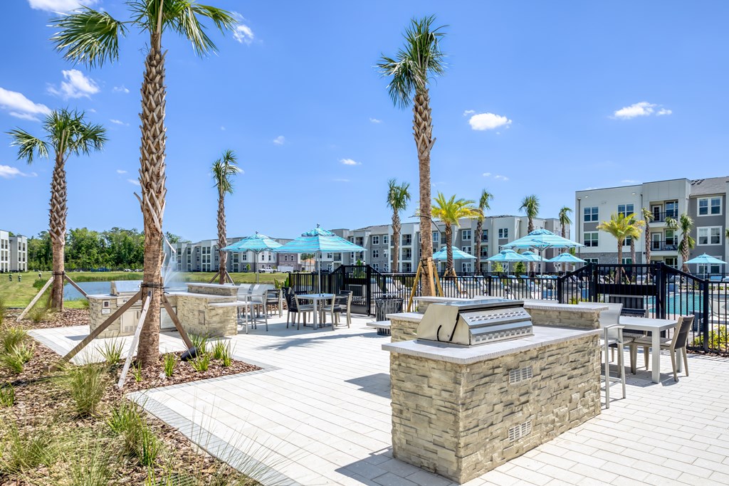 Poolside BBQ and seating area for residents and guests.
