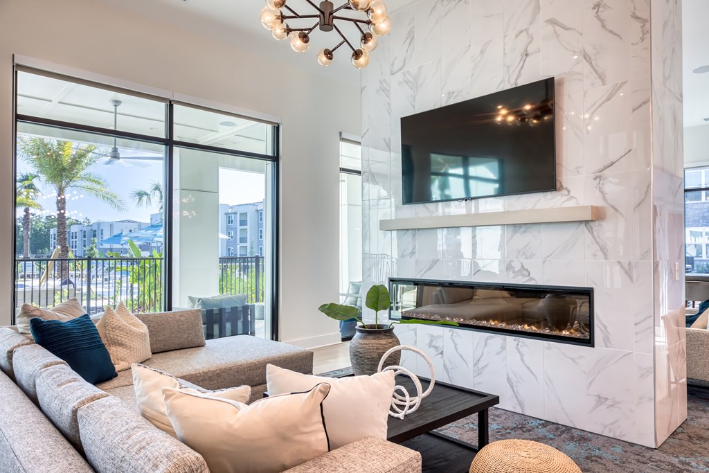 Resident lounge seating, fireplace, and TV.