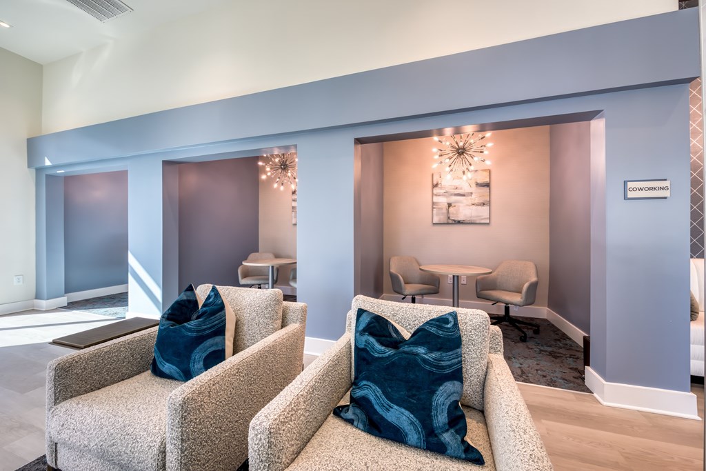 A living room with a couch and chairs.