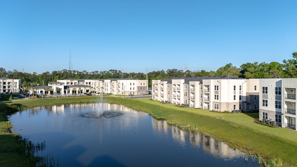 A large body of water is in front of a building.