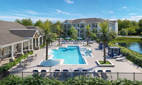 an aerial view of an outdoor pool with chairs and umbrellas at the resort
