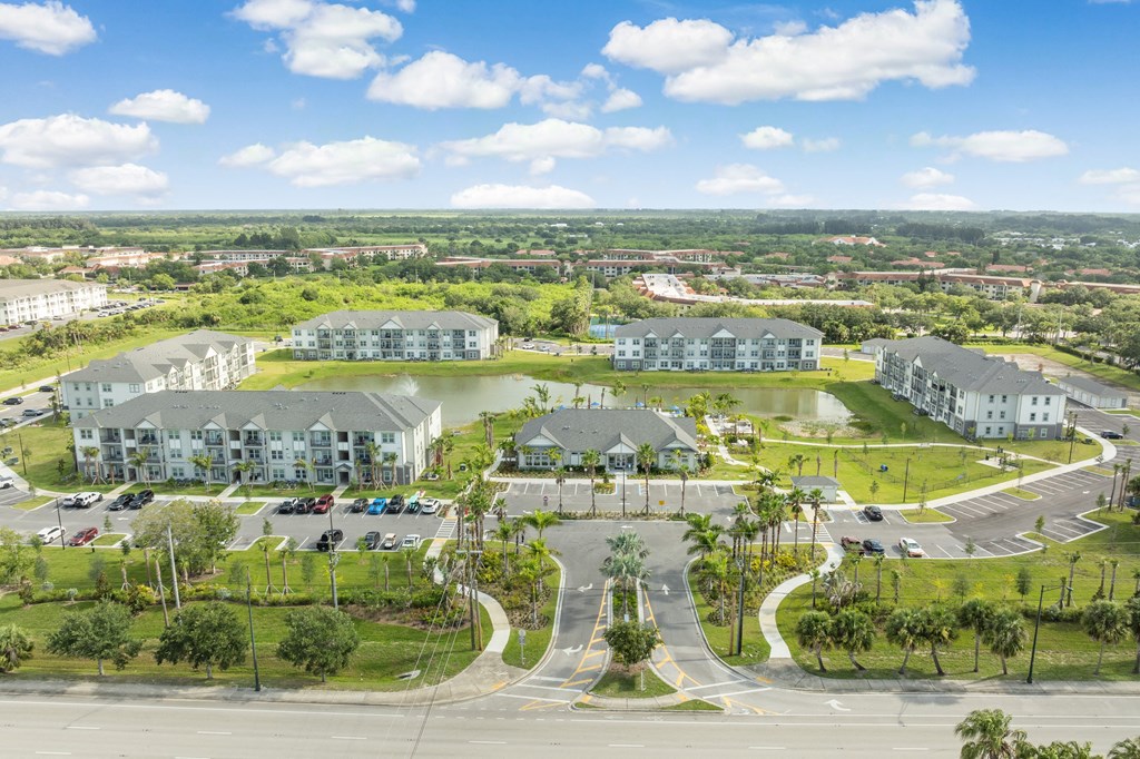 an aerial view of a community with houses and a lake