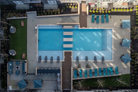 arial view of a pool on the roof of a building
