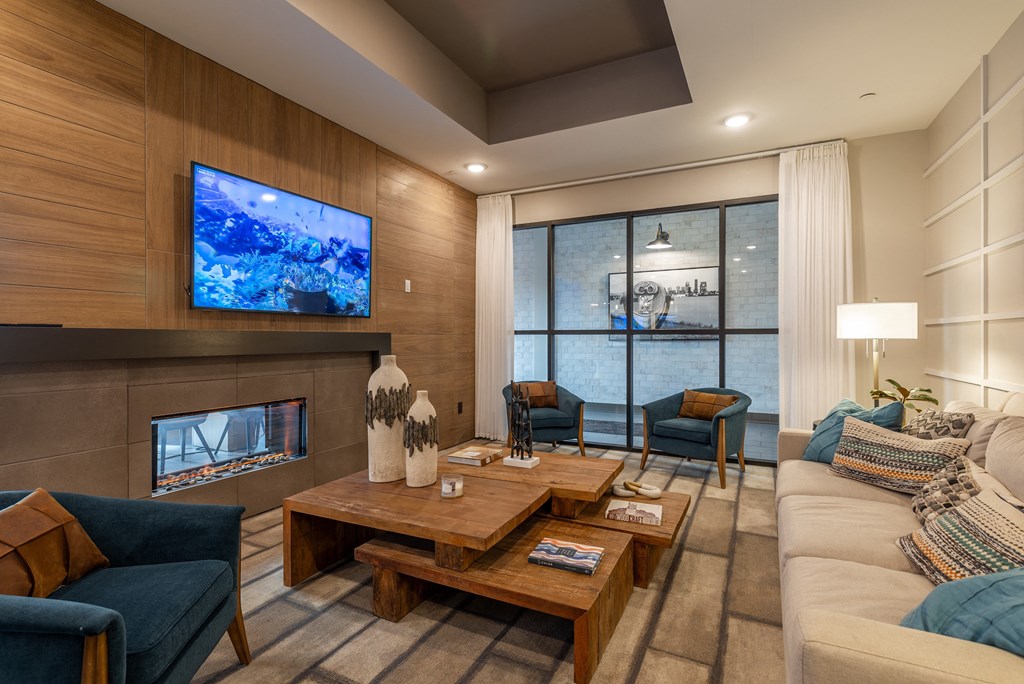 a living room with a couch and a table and a fireplace