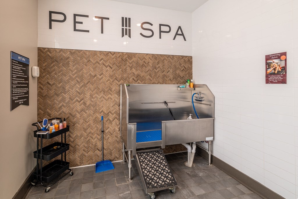 a spa with a sink and a bath tub in a room with a sign above