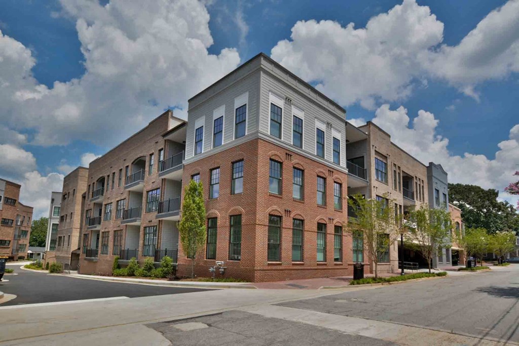 an apartment building on the corner of a street