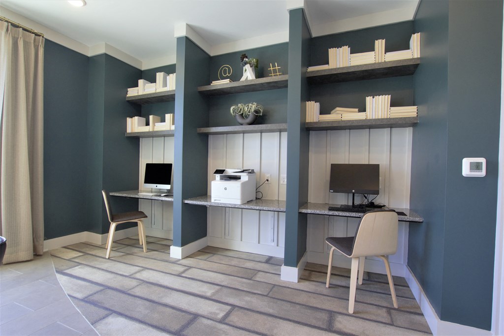 business center with computer stations and a printer