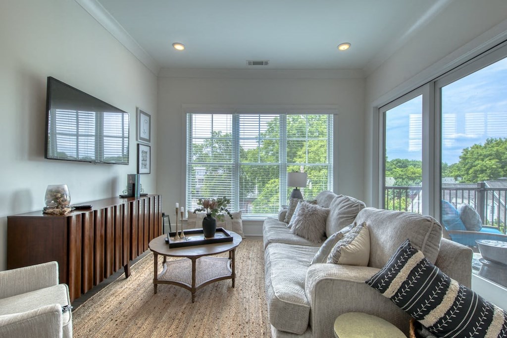 a living room with a couch and a table