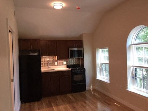 a small kitchen with a stove and a sink