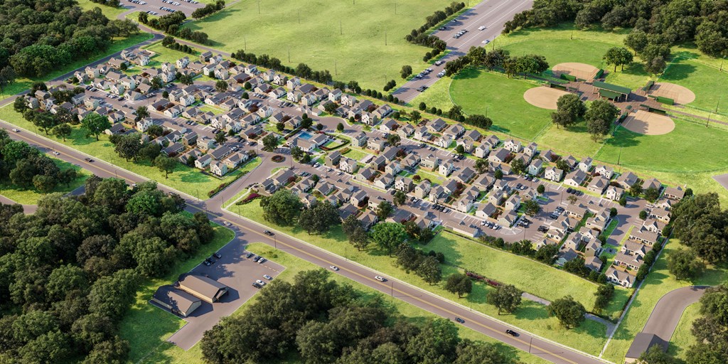 an aerial view of a suburban neighbourhood with cars parked on the street