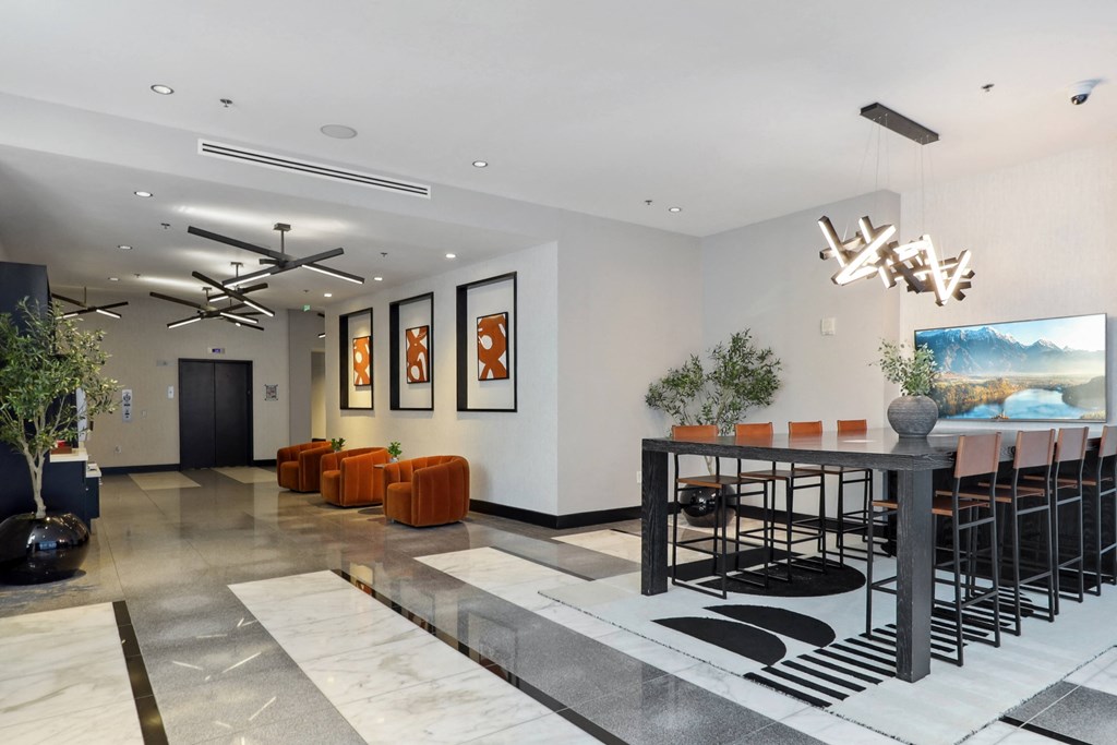 the lobby with a table and chairs at The Zenith, Baltimore, MD, 21201