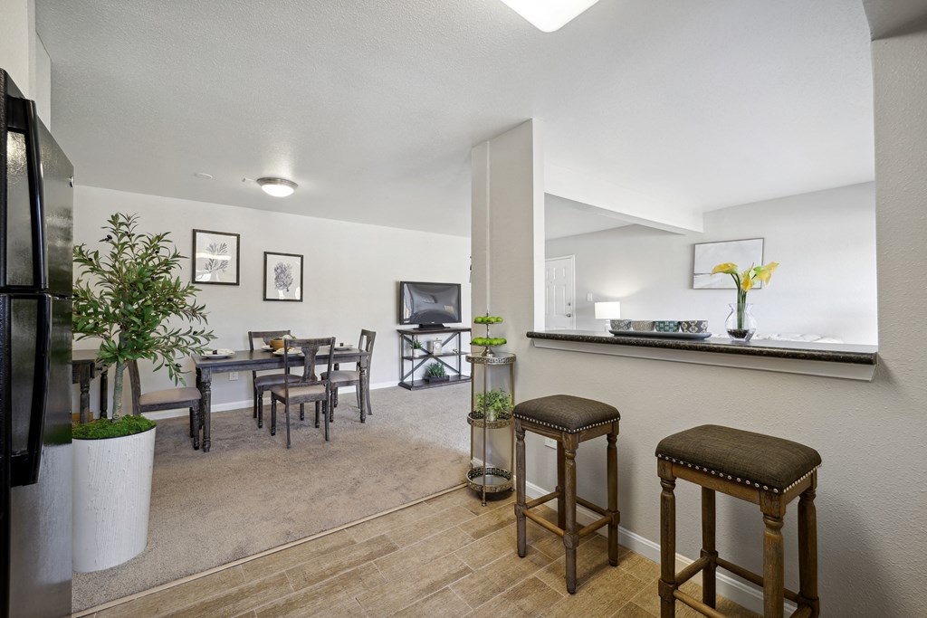 a living room and dining room with a table and chairs at Capitol Heights, Capitol Heights