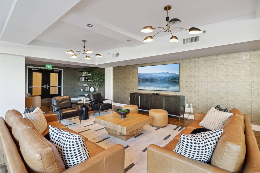 a living room with couches and chairs and a table at The Zenith, Baltimore