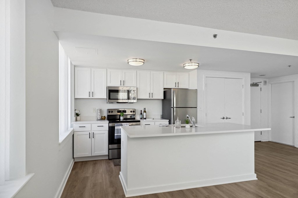 an open kitchen and a living room at The Zenith, Baltimore