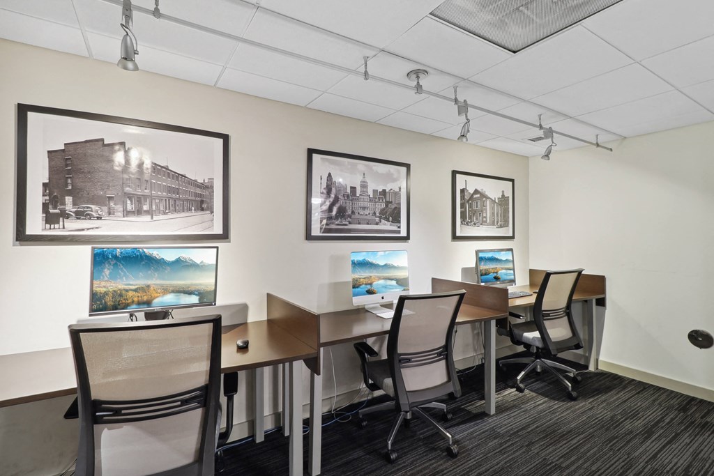 a conference room with desks and chairs and pictures on the wall at The Zenith, Baltimore, MD, 21201