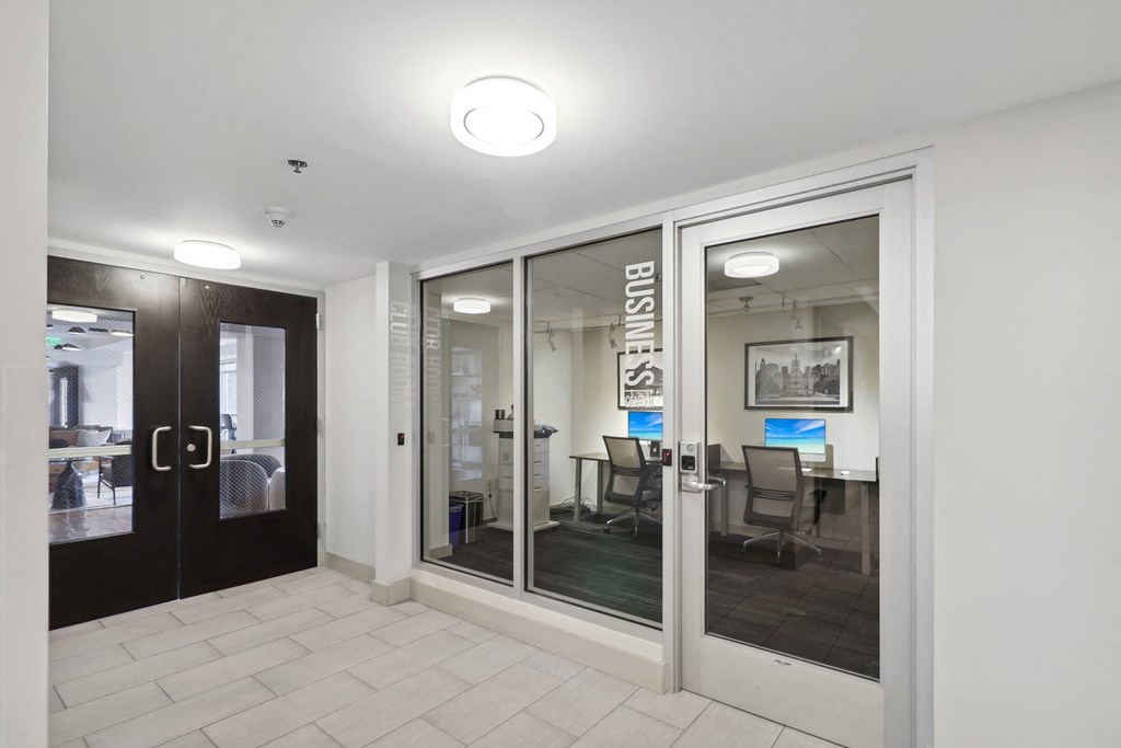 a view of a conference room with glass doors and a table with chairs at The Zenith, Maryland