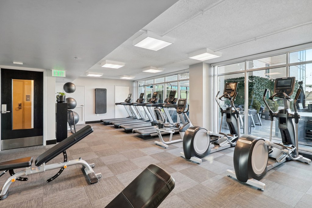 a fitness center with machines and weights at The Zenith, Baltimore