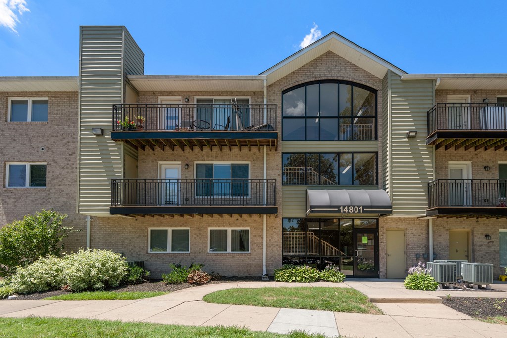 Building with balconies and a sidewalk at Laurel Pines, Maryland, 20708