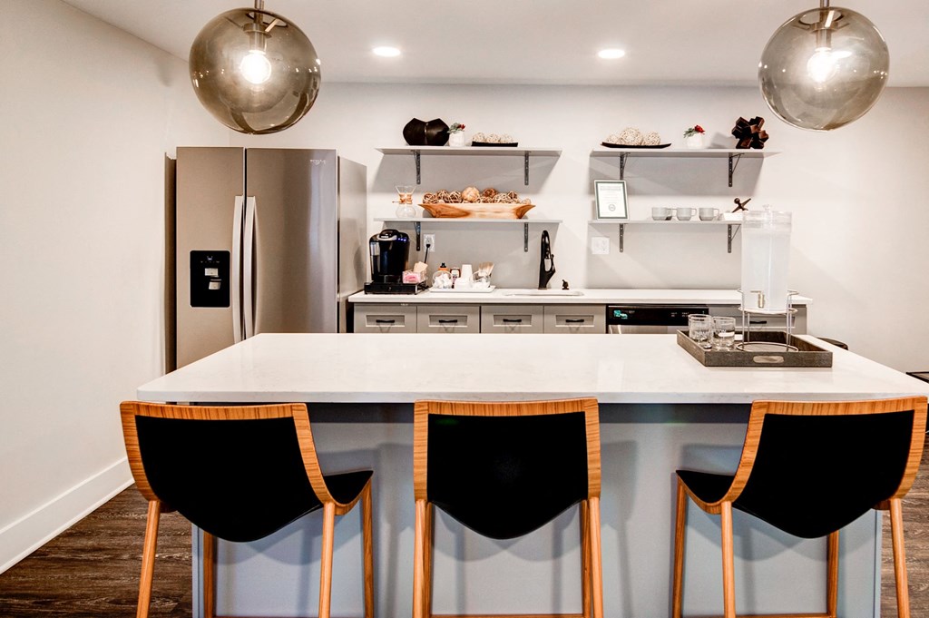 a kitchen with a large center island with a white countertop at Hamilton at Kings Place, Maryland, 21046