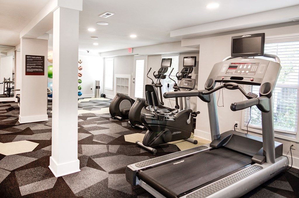 a spacious fitness room with treadmills and elliptical trainers at Hamilton at Kings Place, Columbia, 21046