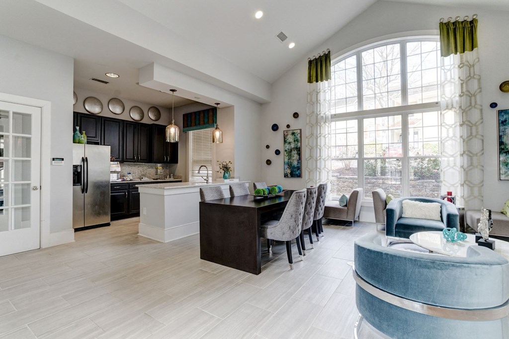 a kitchen and living room with a large window at Ellicott Grove, Ellicott City, MD