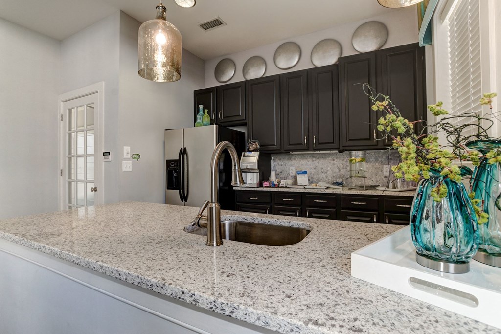 a kitchen with a sink and a refrigerator at Ellicott Grove, Ellicott City Maryland