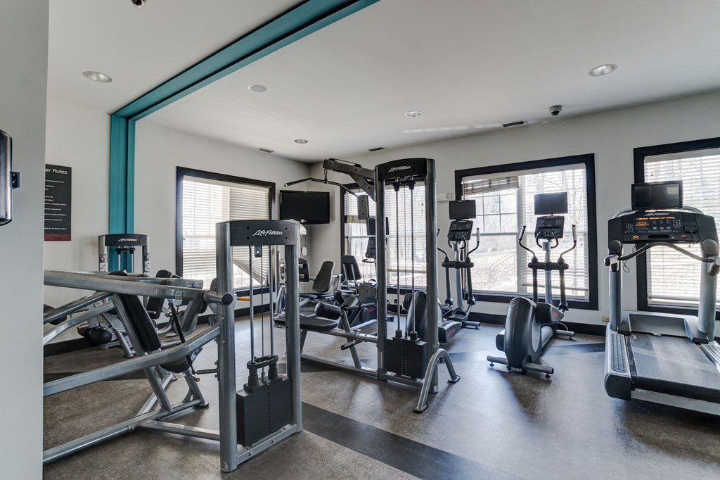 a gym with cardio equipment and weights at Ellicott Grove, Ellicott City, MD