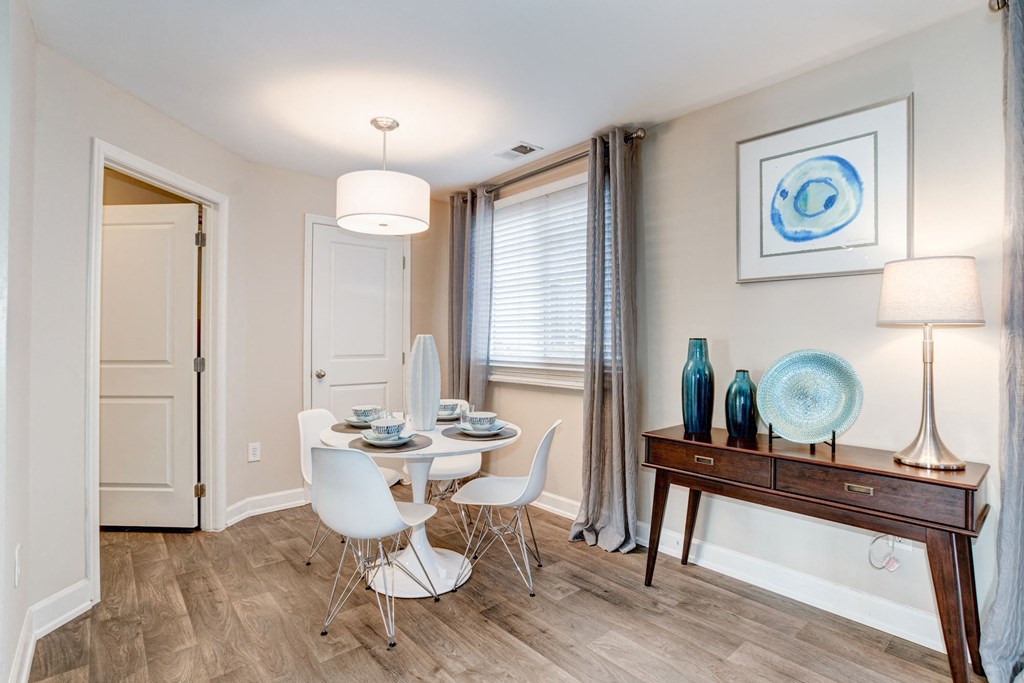 a dining room with a table and chairs at Ellicott Grove, Maryland, 21043