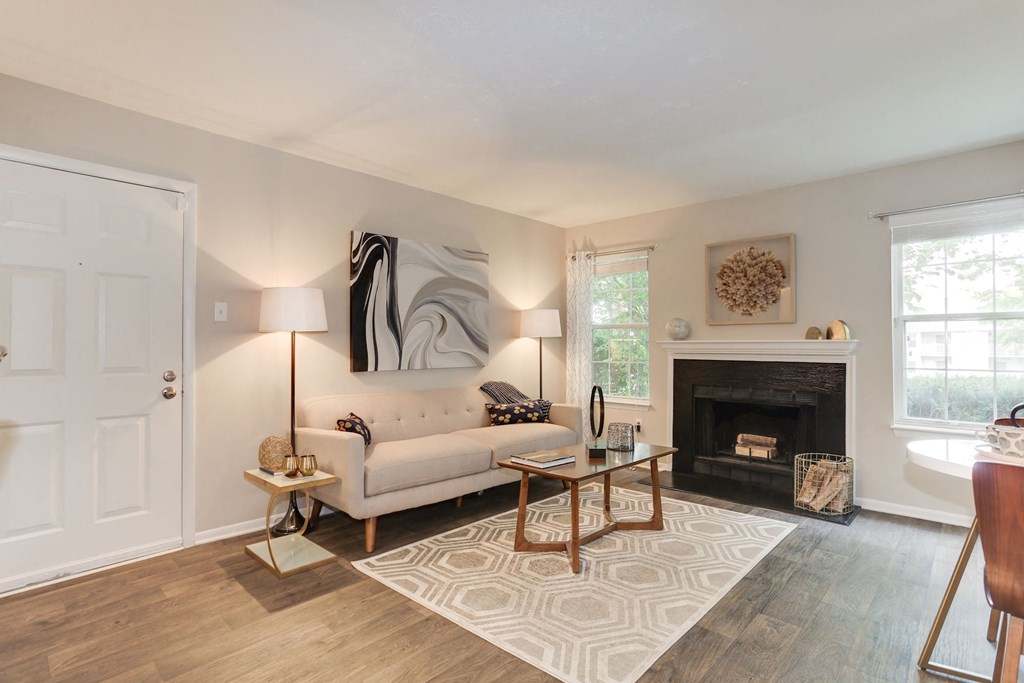 a living room with a fireplace and a couch at Madison at Eden Brook, Columbia, 21046