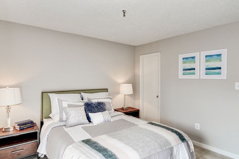 a bedroom with a bed and two night stands at Hamilton at Kings Place, Columbia, 21046