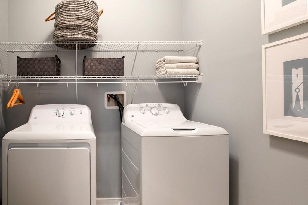 a washer and dryer in a small laundry room