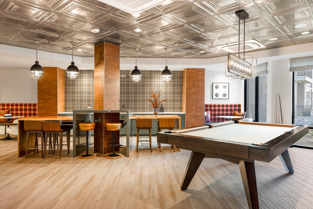 a room filled with furniture and a pool table