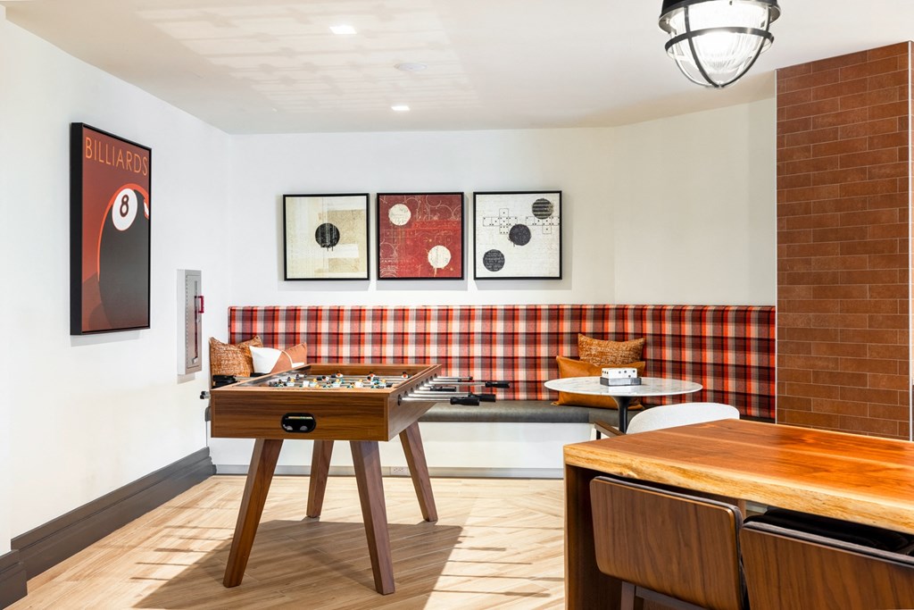 a recreation room with a foosball table