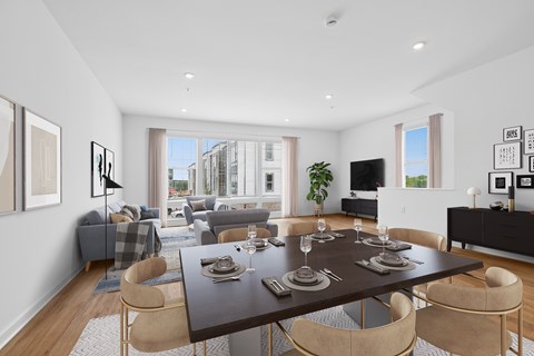 A modern dining room with a large table set for six.